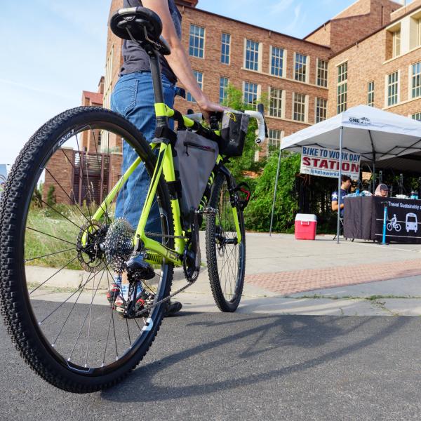 Cyclists stop at the Bike to Work booth near the Jennie Smoly Caruthers Biotechnology building