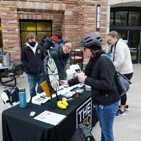 Cyclists in front of Winter Bike to Work Day booth by the Rec Center