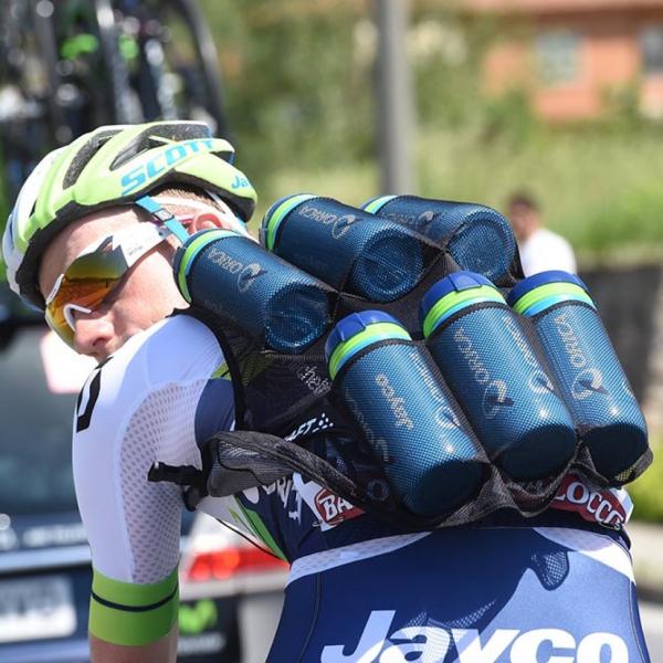 Bicyclist carrying an excessive amount of water bottles.