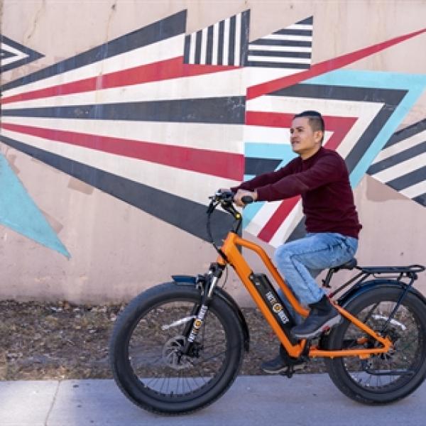 Man riding an electric bicycle.