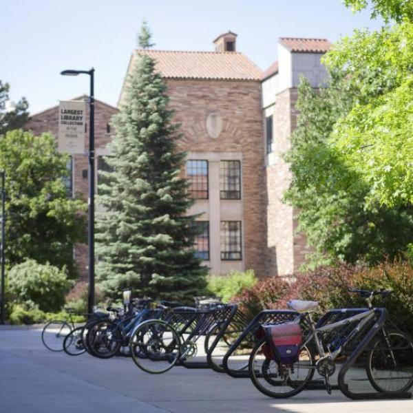 Bikes stored at a bike rack in CU Boulder campus