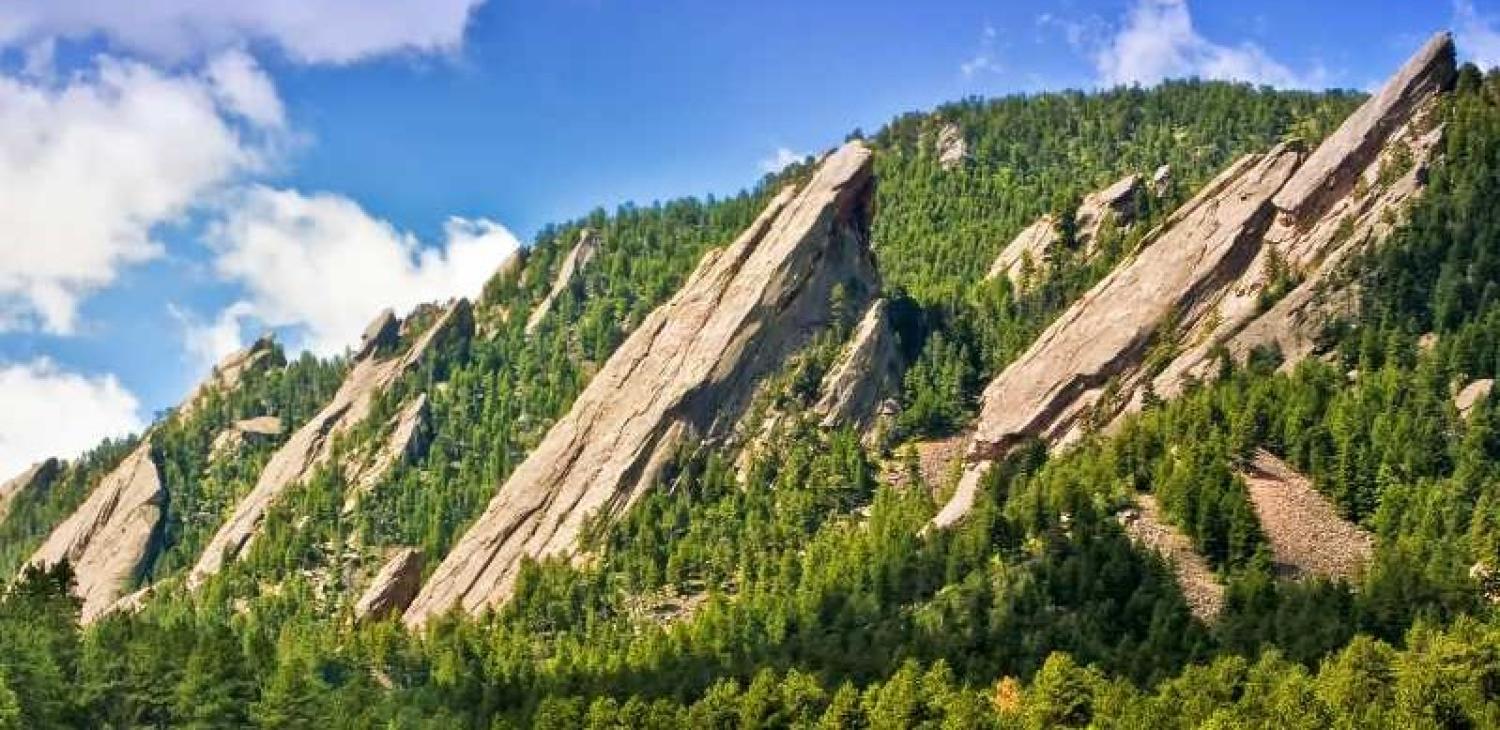 Image of the Flatirons in summer weather.