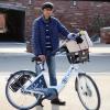 Ravin, CU student and one millionth BCycle rider, poses with his prize package.