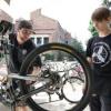 A bike mechanic repairs a bike at the UMC Bike Station.