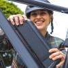 Woman holding e-bike battery.