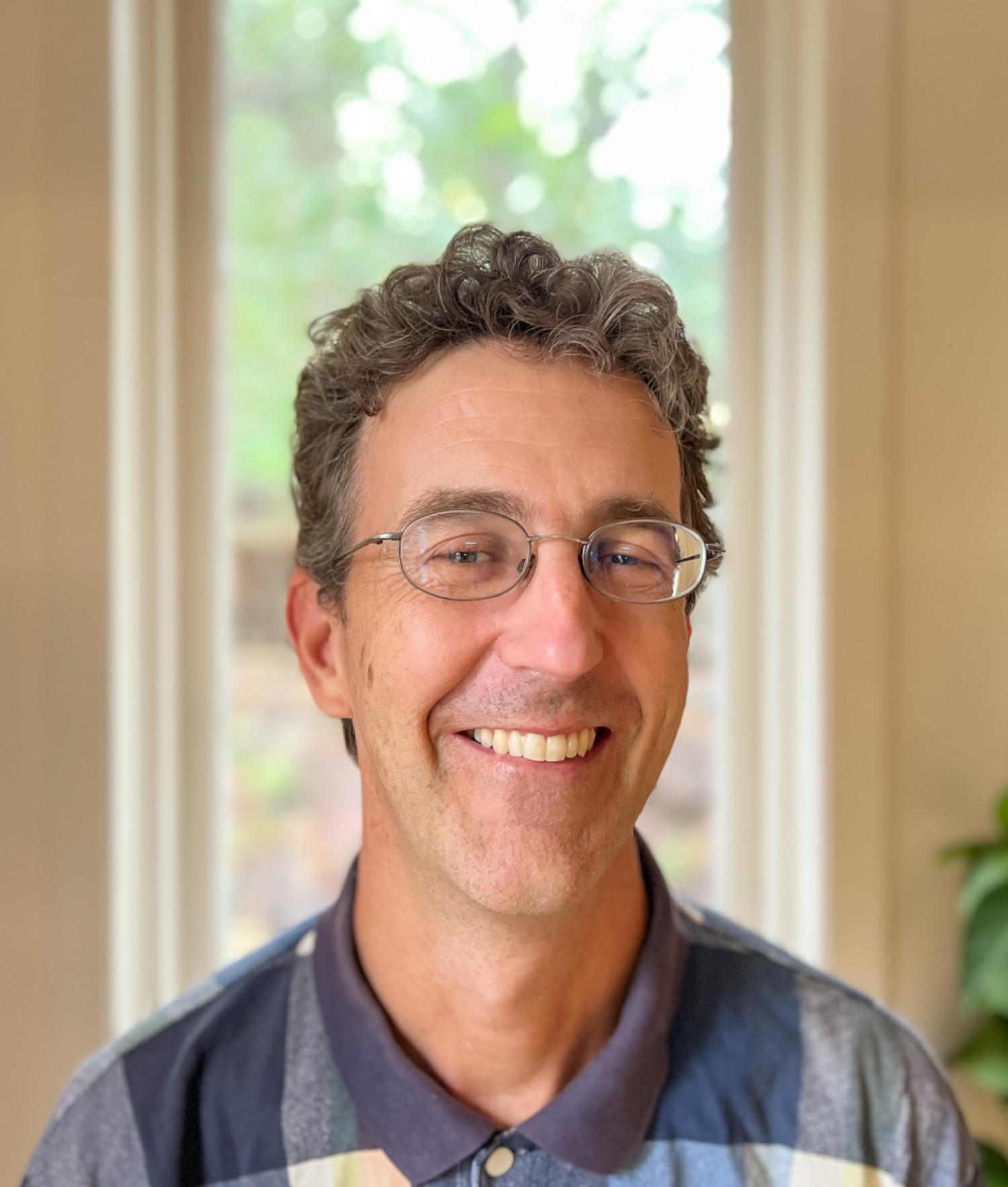 Nathan Pieplow in front of a window