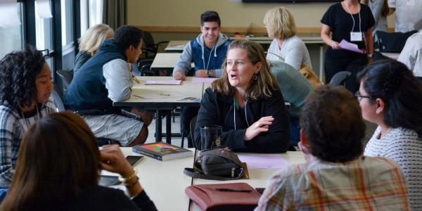 Students and instructor gathered around a table