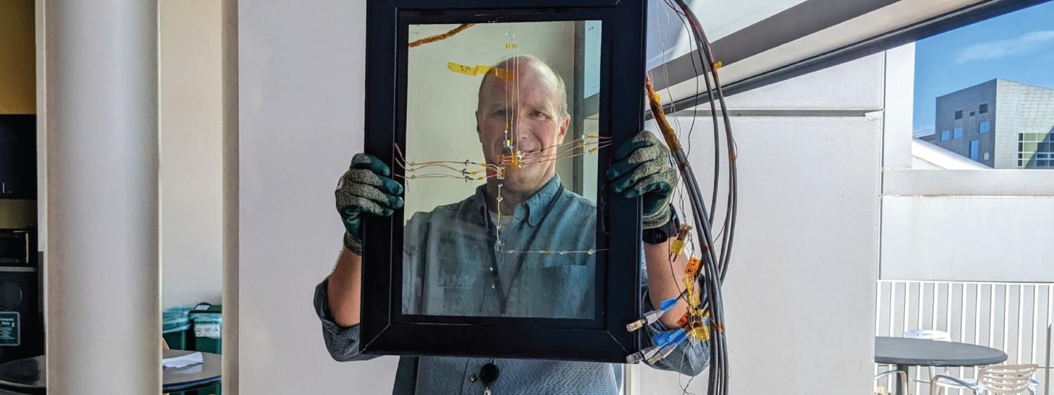 Rob Tenent holding up an advanced window