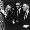 Oppenheimer and other scientists working on a machine