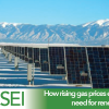 Solar panels with mountains in the background