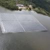 Publication TOC Graphic showing a floating solar panel installation on the surface of a lake