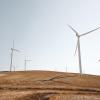 Wind turbines on the side of a hill