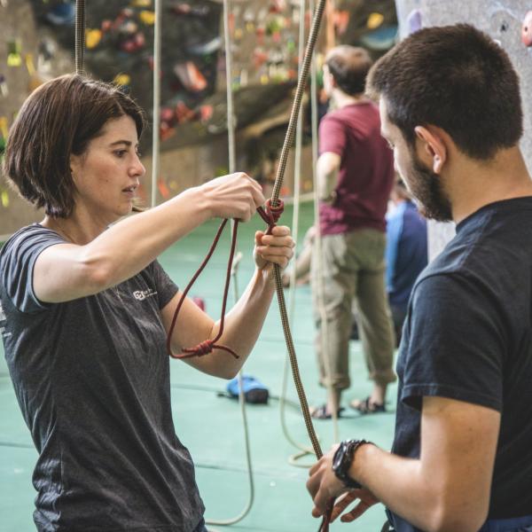 student being shown how to climb