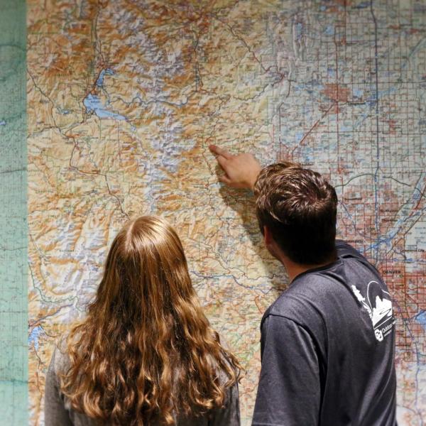 people planning a trip on a map
