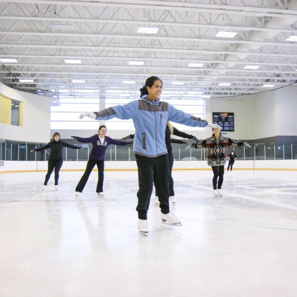 woman ice skating with a group