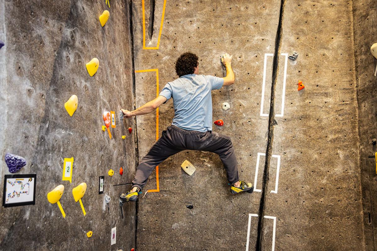 student on climbing wall