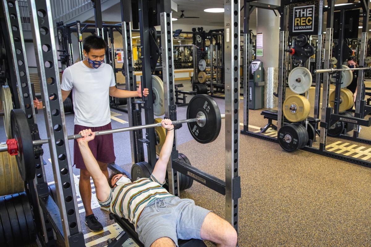 two students working out at the rec