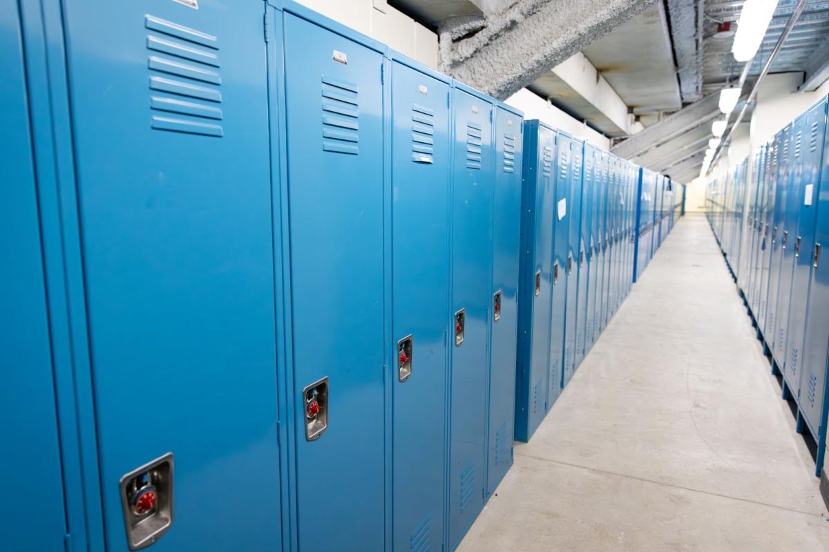 Photo of the interior space of a hockey locker room at the Rec Center.