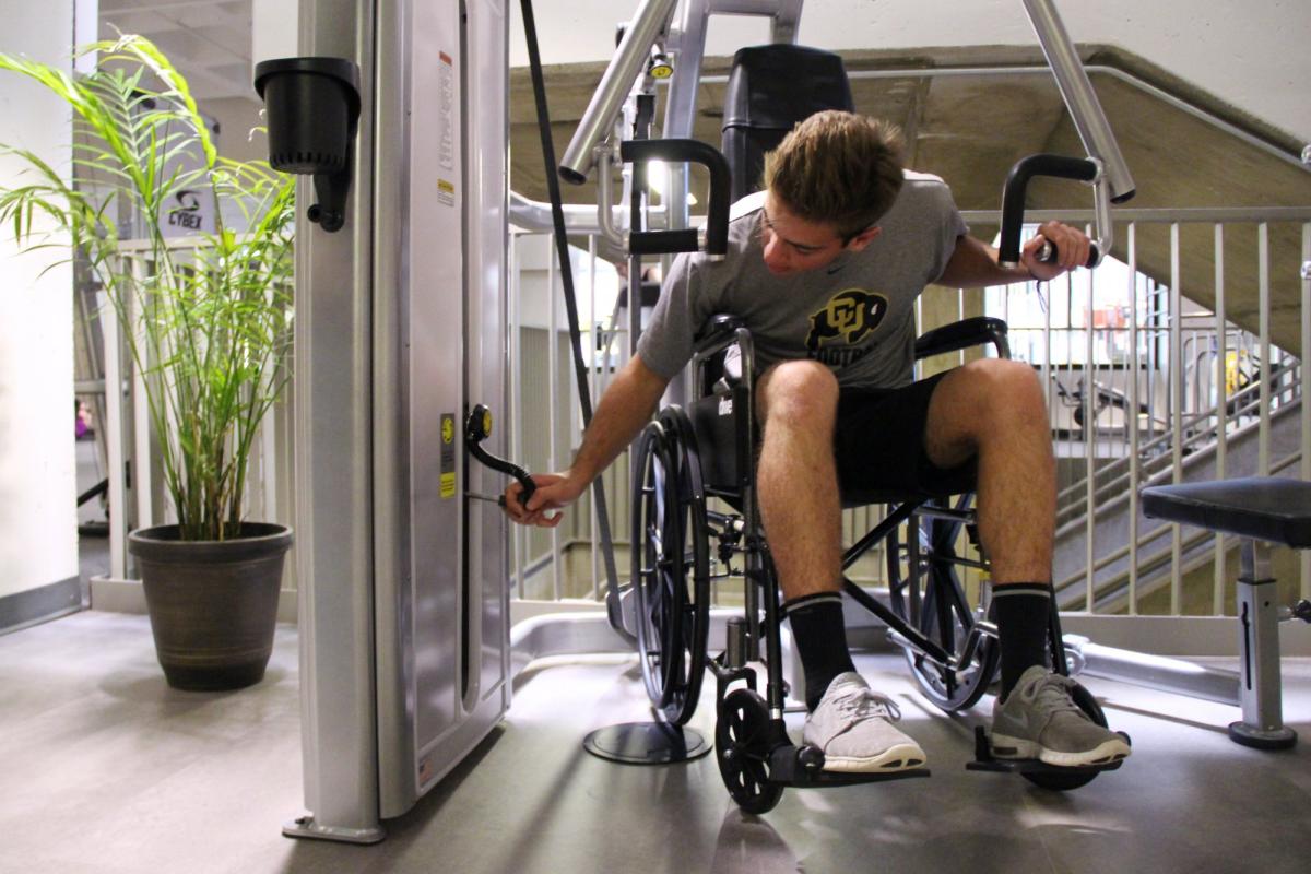 Student in wheelchair using ADA equipment