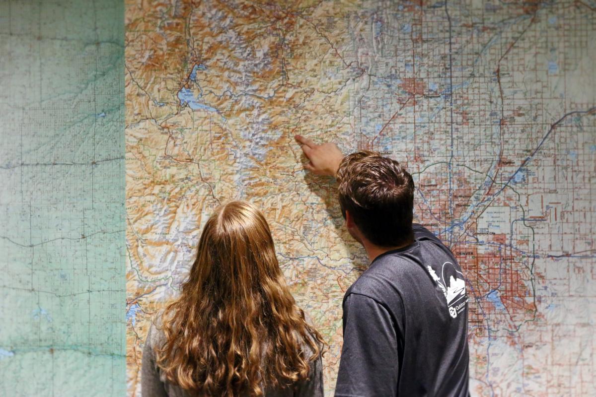 student pointing at a map