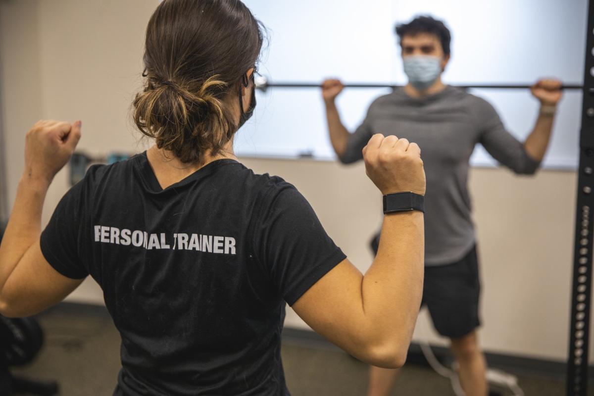 trainer working with a student