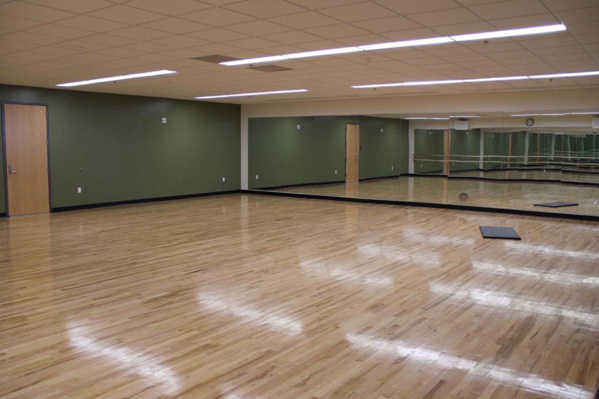 wood paneled studio with green walls