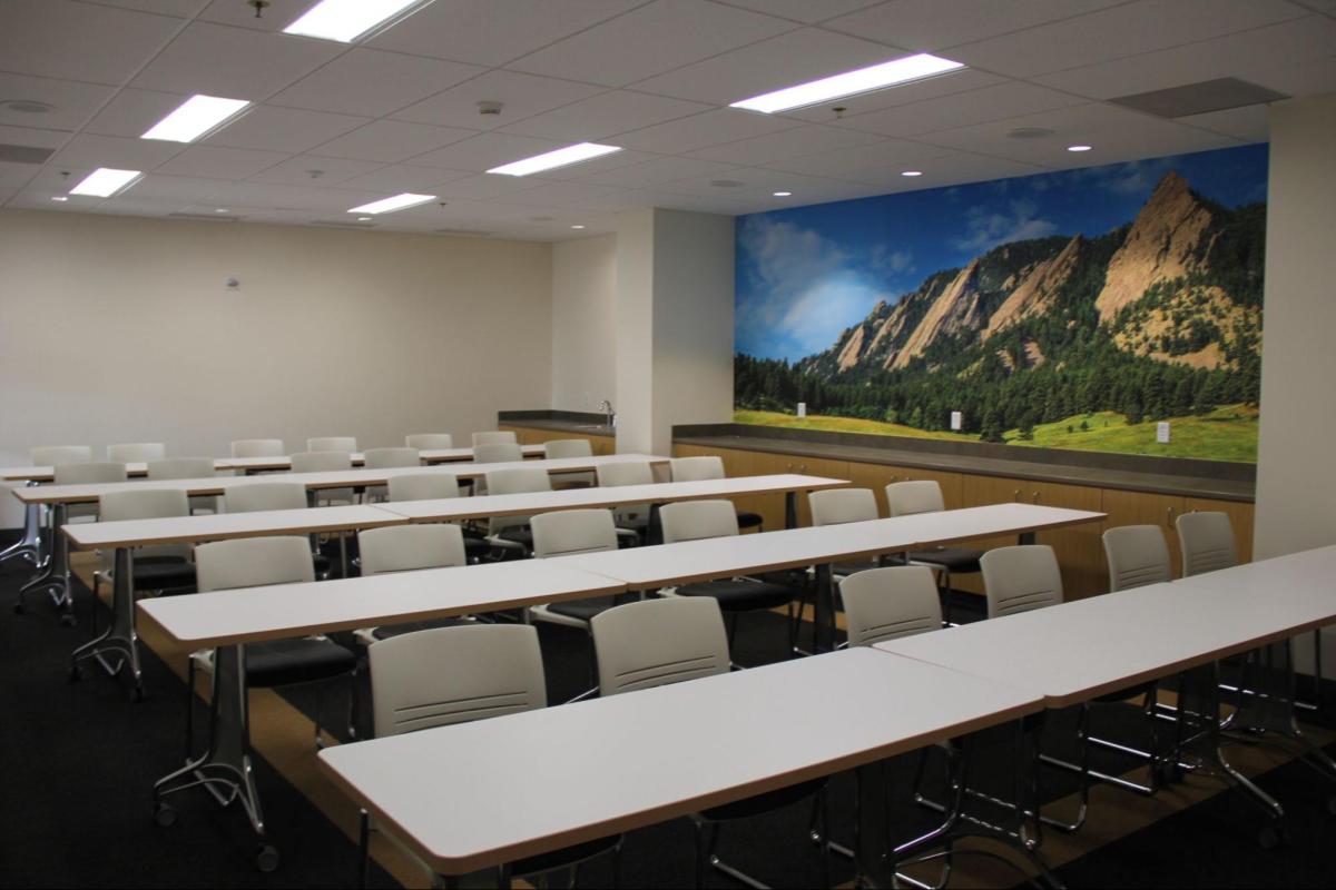studio four meeting room with two long tables and a dozen chairs