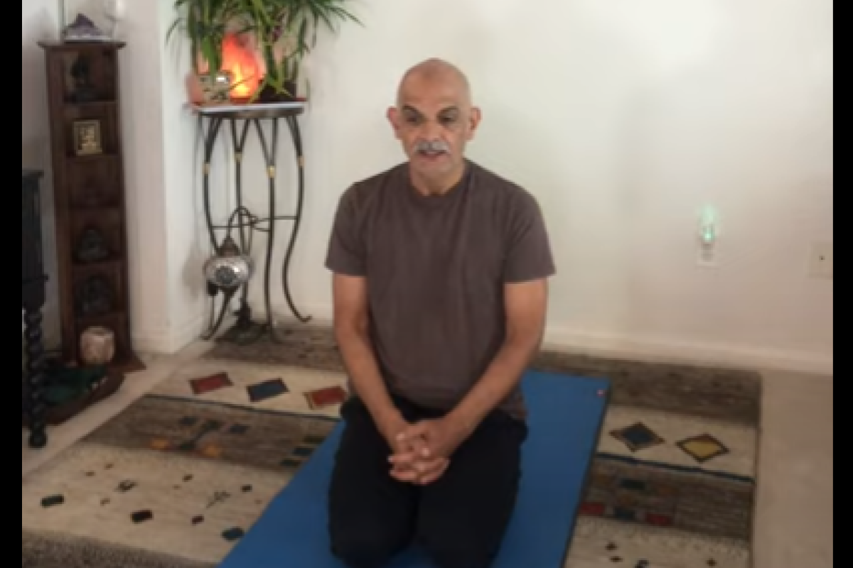 Mahmoud alone doing yoga breathing
