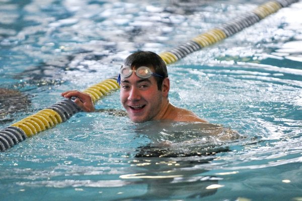 smiling man in a pool