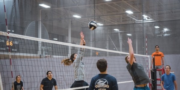 Students playing volleyball