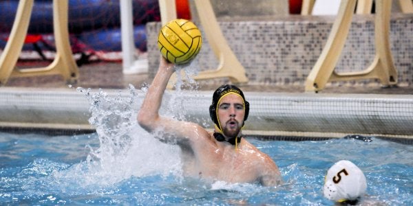 Player passing ball in pool