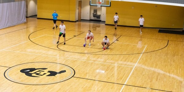 students playing dodgeball on the CU buff court