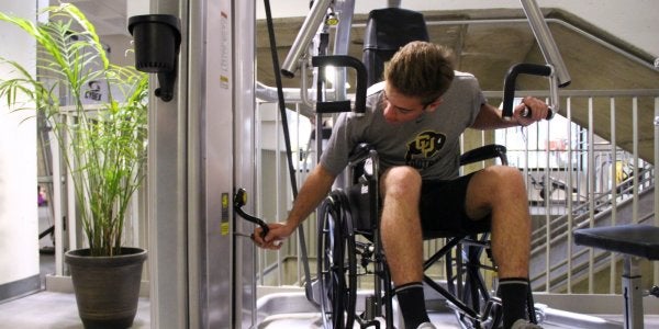 Student in wheelchair using ADA equipment