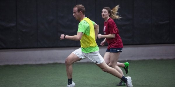 Students playing indoor soccer