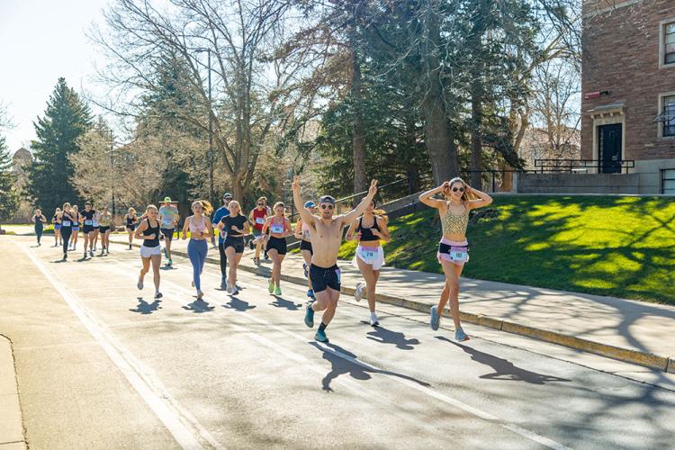 students running on campus