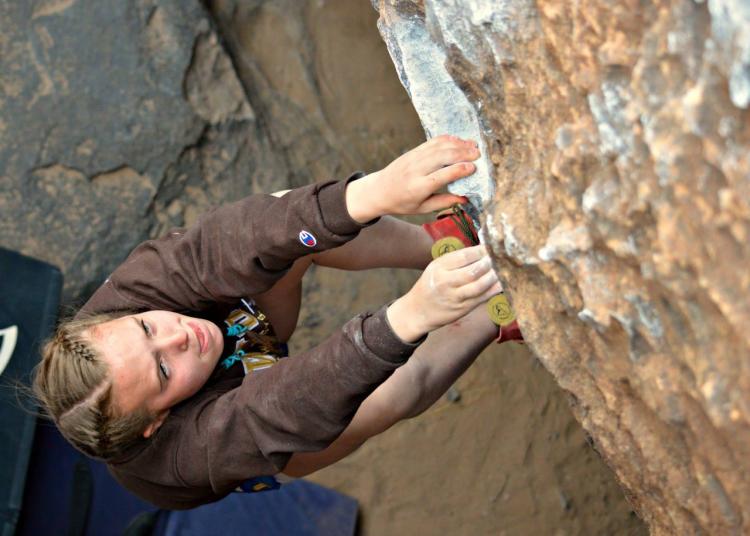 woman climbing a mountain