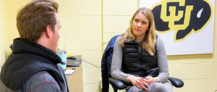 student talking to a counselor at lets talk