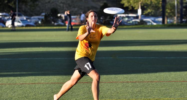 woman catching a frisbee