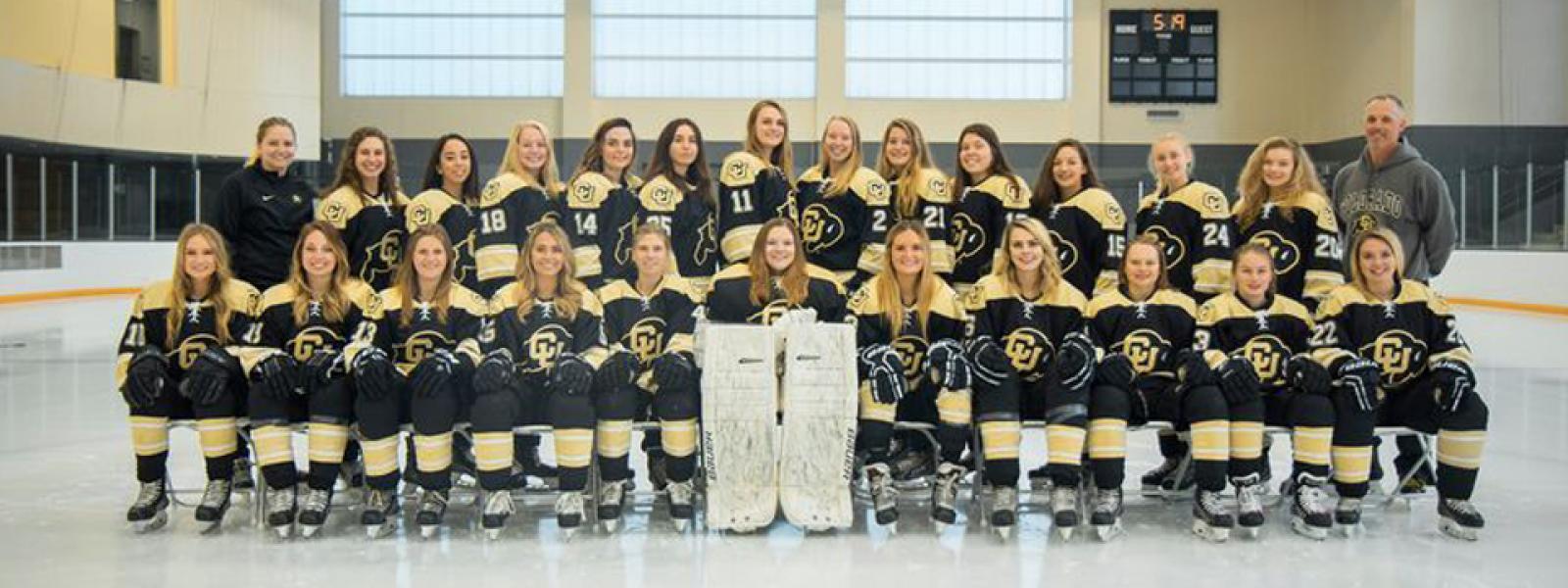 the 2019-2020 women's hockey team posing on the ice