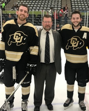 CU Buffs hockey players and coach