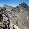 student on a mountain peak