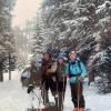 happy family posing together in the snow
