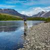 solitary man fly fishing in a lake