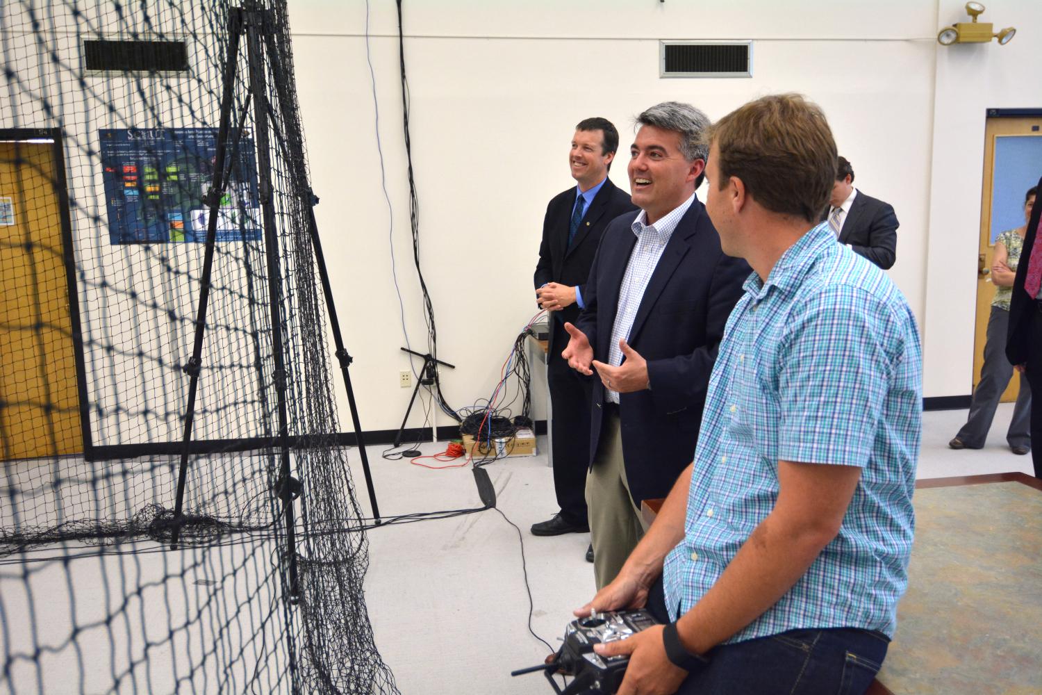 Sen Gardner watches a drone fly