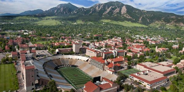 Aerial view of CU Boulder campus with Folsom Field in the foreground.