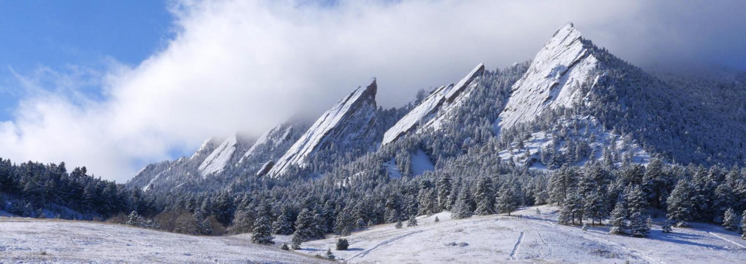 wide shot picture of flatirons mountains Chautaqua park