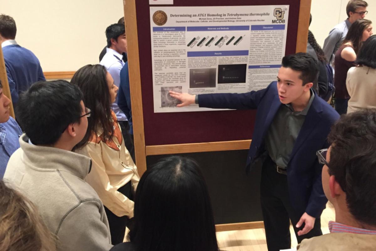 student presenting poster