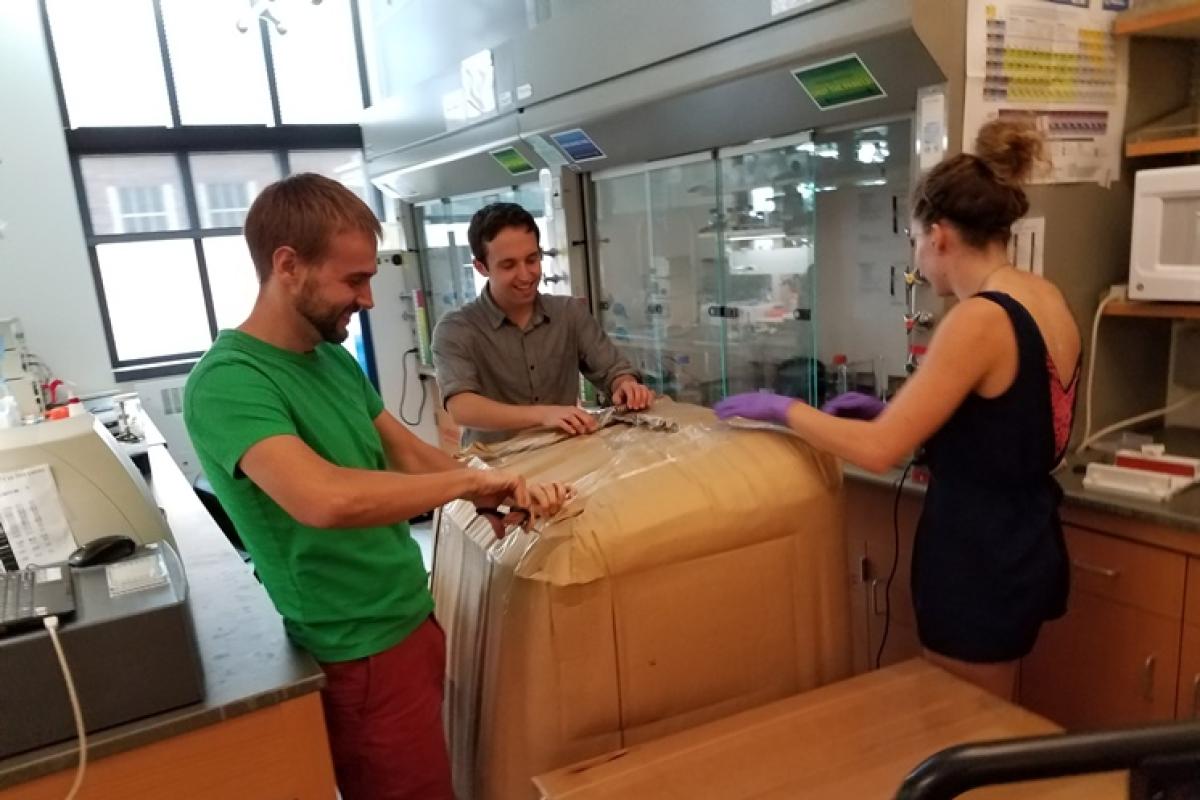 Three lab members excited to receive new equipment