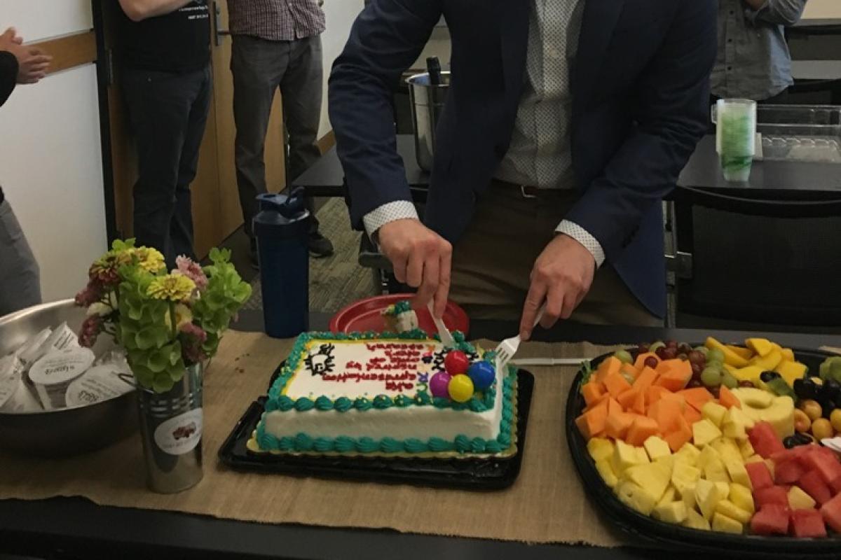 Peter cutting the CRISPR inspired cake