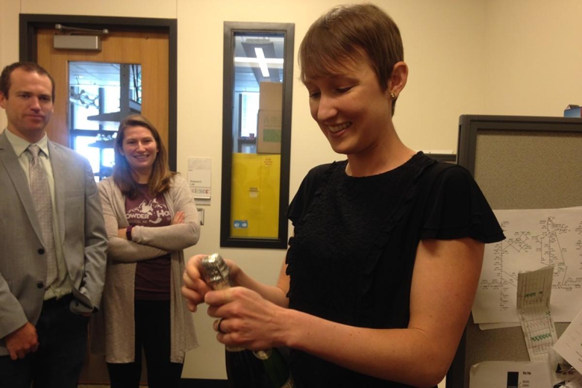 Keesha popping the champagne
